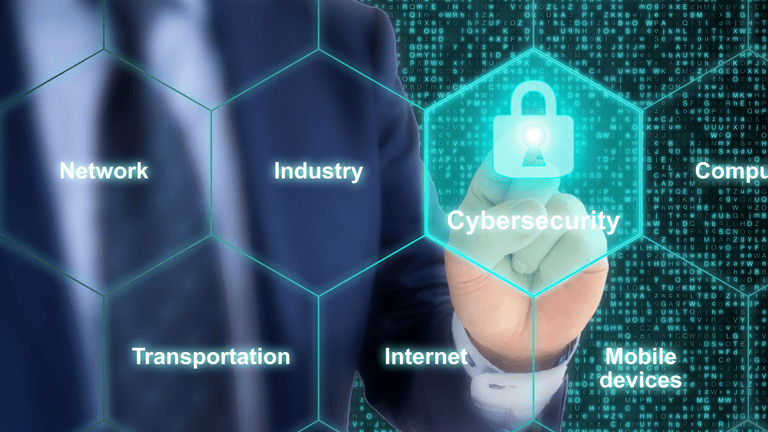 Businessman touching a digital padlock icon labeled Cybersecurity among technology-related terms